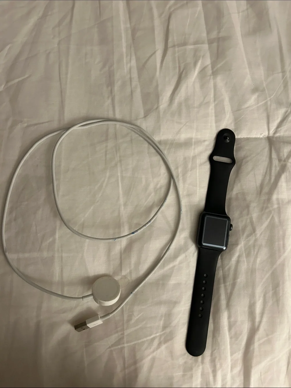 Apple Black Smartwatch with White Magnetic Charger